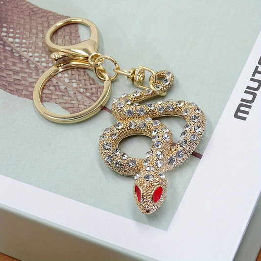 Fashionable golden and silver snake design keychain made of alloy for women, perfect for decoration purposes.