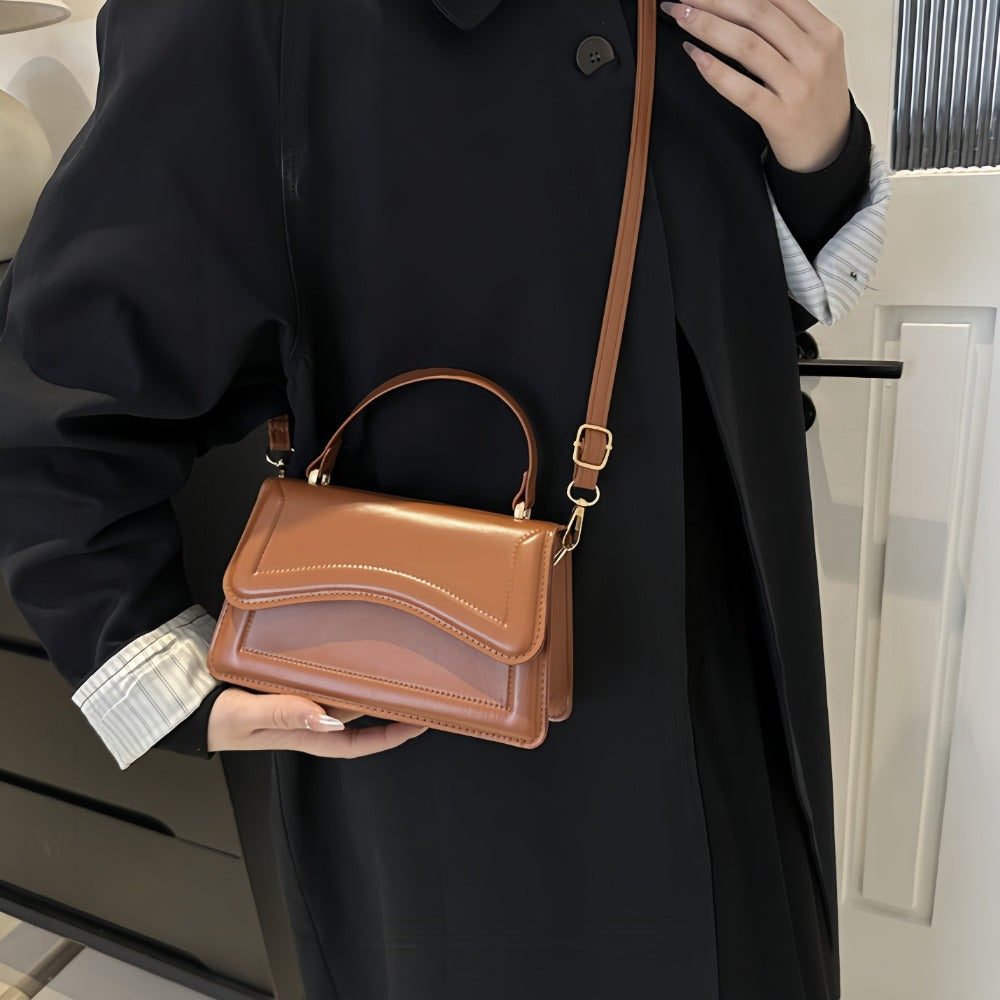 Women's Fashion Crossbody Shoulder Bag in solid color faux leather with adjustable strap, buckle closure, painted edges, perfect for casual or elegant occasions in Guangzhou.