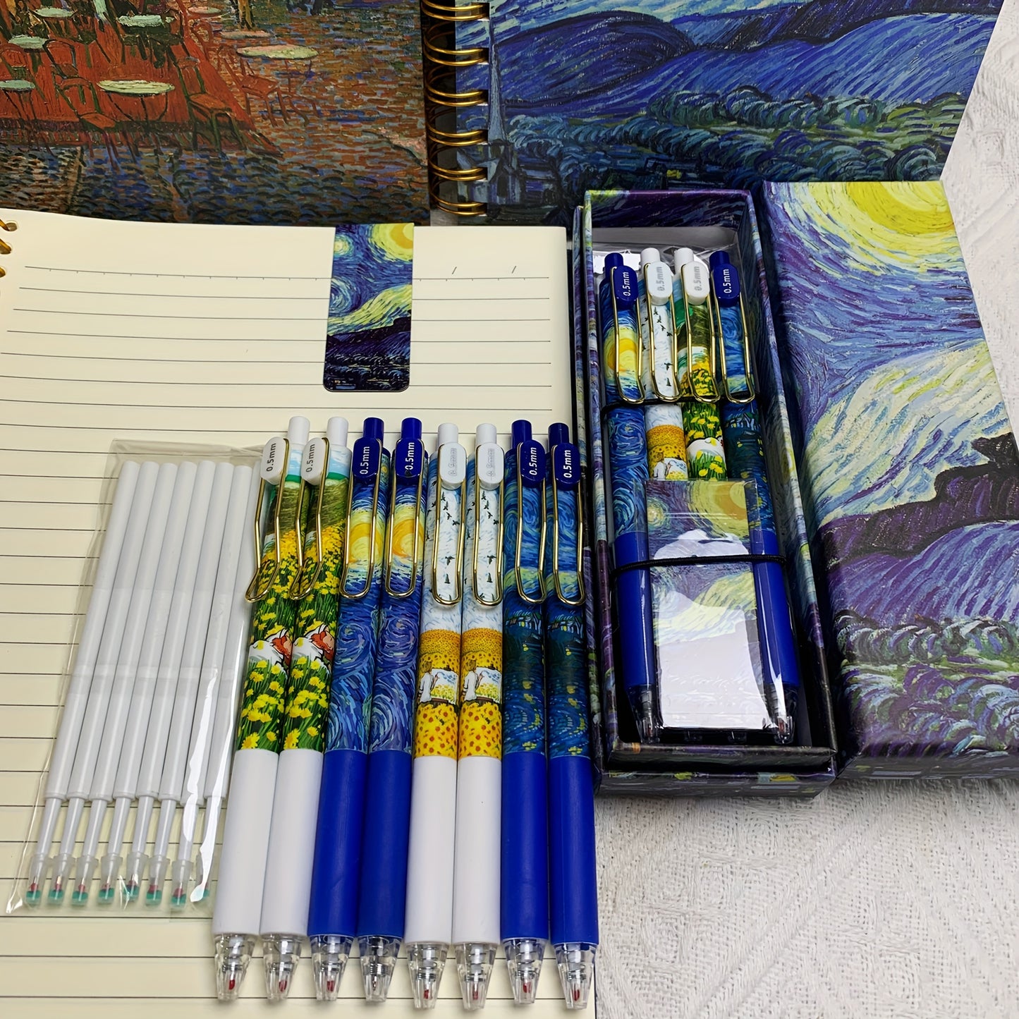 4pcs Set of Van Gogh Starry Night Pens with retractable 0.5mm fine tip, high quality and smooth writing. Ideal for diaries and school supplies.