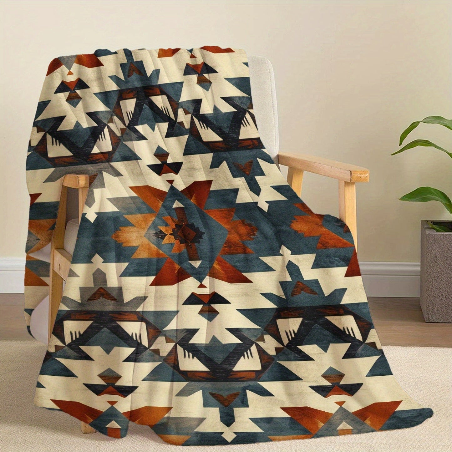 Soft and cozy Aztec-inspired digital print flannel blanket for bed, sofa, and travel. This lightweight, all-season blanket offers warmth, is machine washable, and made of 100% polyester with a contemporary style and no embellishment.