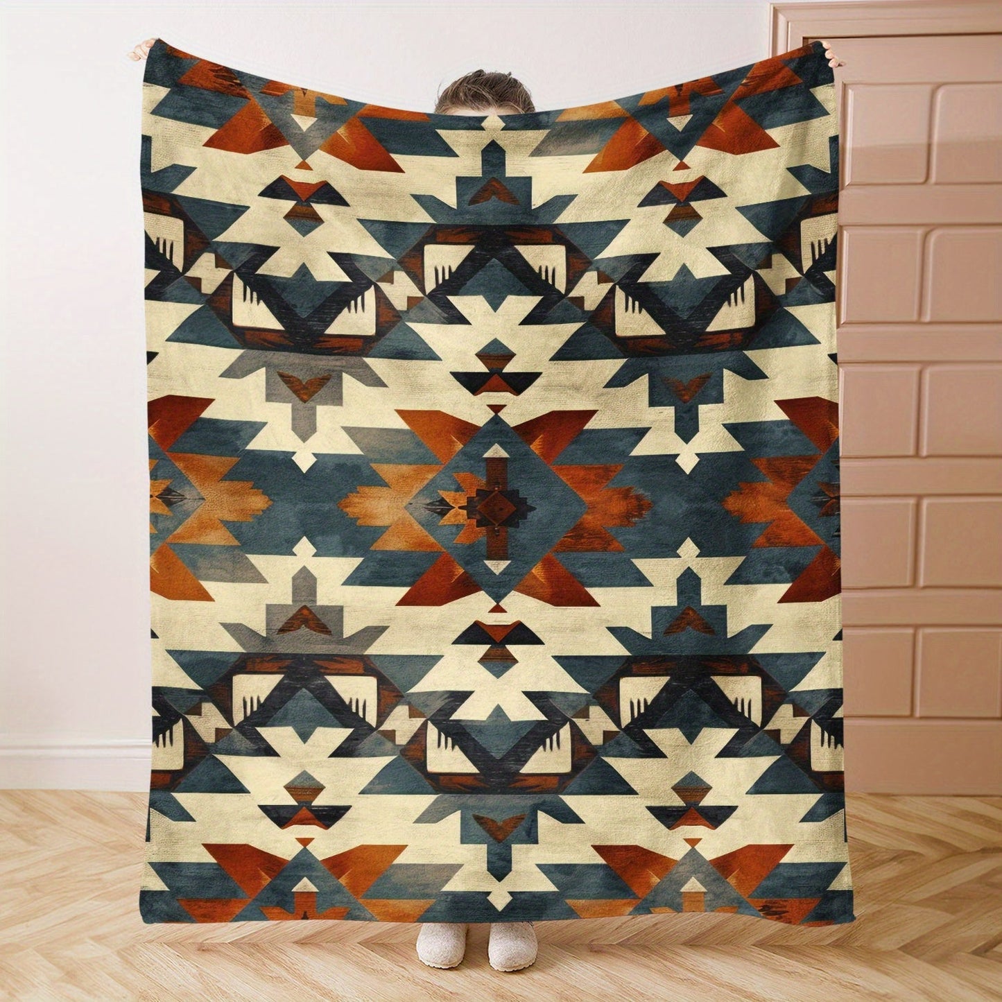 Soft and cozy Aztec-inspired digital print flannel blanket for bed, sofa, and travel. This lightweight, all-season blanket offers warmth, is machine washable, and made of 100% polyester with a contemporary style and no embellishment.