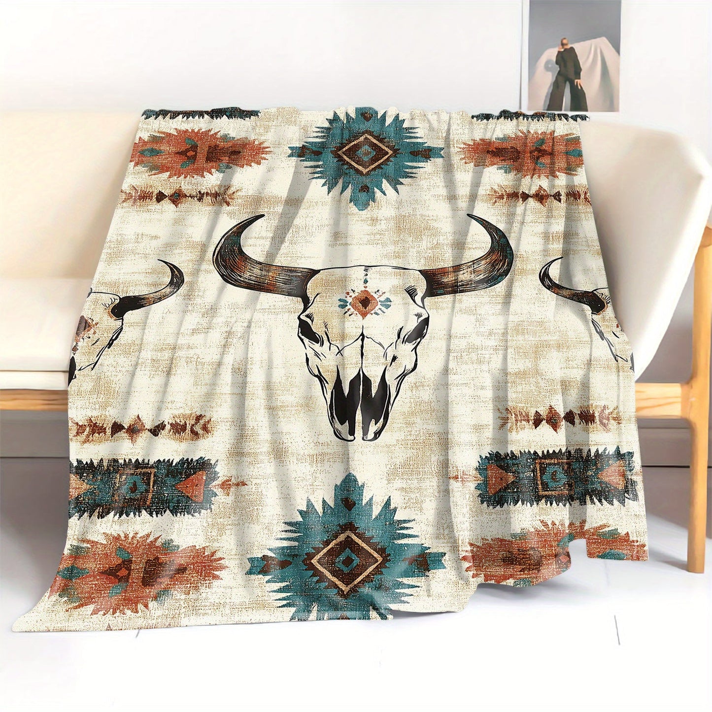 Soft knitted polyester throw blanket with a Western cow skull print. Perfect for bed, sofa, office, or camping. Suitable for all seasons with a mid-century style. Lightweight fabric weighing 200-250g. Features a digital print with no embellishments.