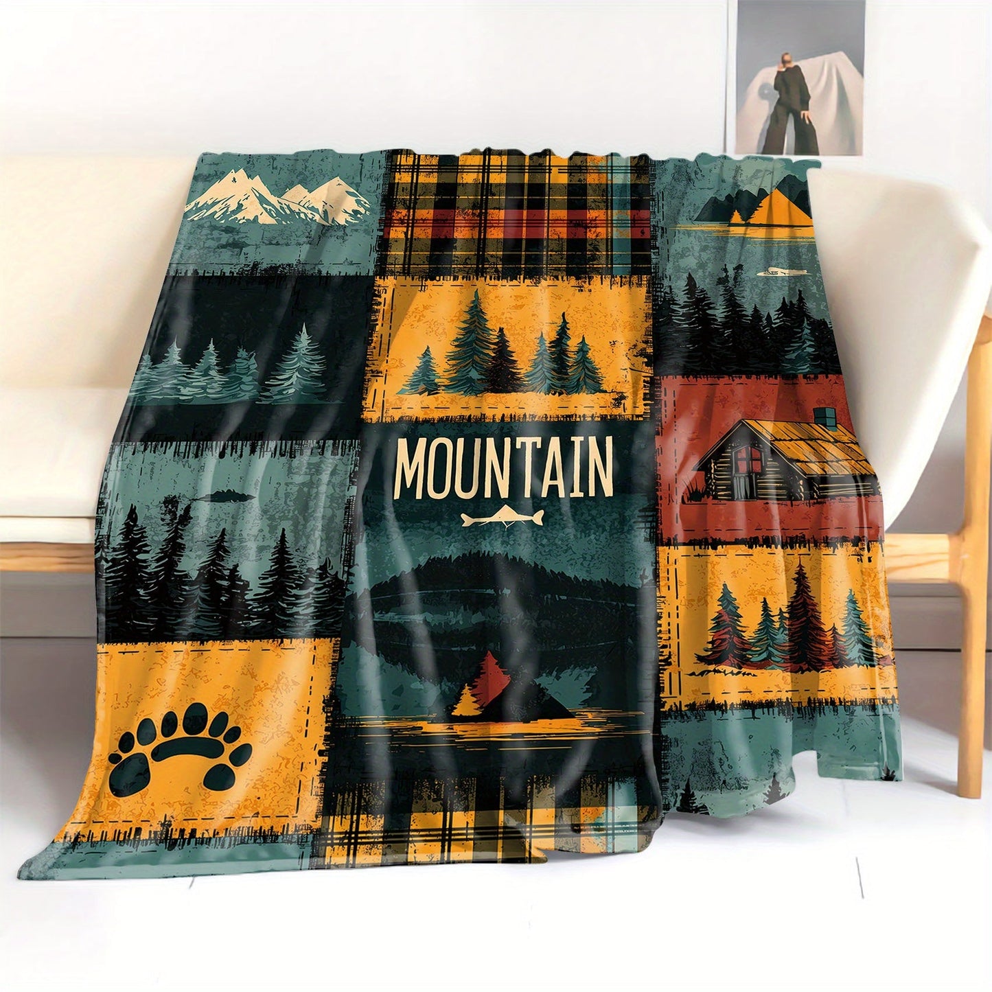 Soft polyester knit throw blanket with a mid-century outdoor patchwork design featuring digital print of mountains and forests. This all-season lightweight cover is perfect for bed, sofa, office, or camping.