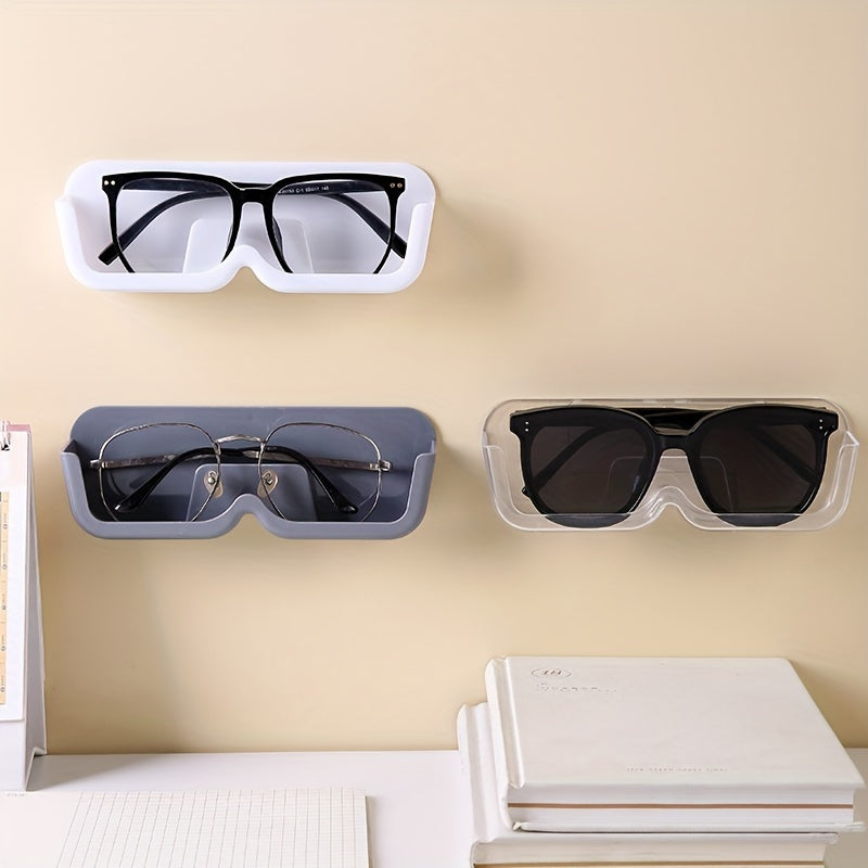 Sleek wall-mounted glasses display stand in light gray made of durable plastic. This space-saving organizer is perfect for eyewear and fashion glasses, ideal for bedside or desk use. Features a classic style.