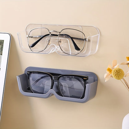 Sleek wall-mounted glasses display stand in light gray made of durable plastic. This space-saving organizer is perfect for eyewear and fashion glasses, ideal for bedside or desk use. Features a classic style.