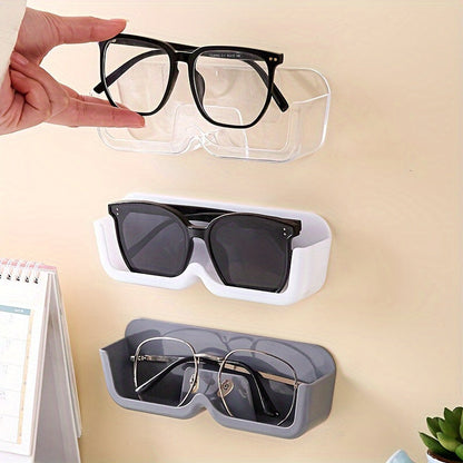 Sleek wall-mounted glasses display stand in light gray made of durable plastic. This space-saving organizer is perfect for eyewear and fashion glasses, ideal for bedside or desk use. Features a classic style.