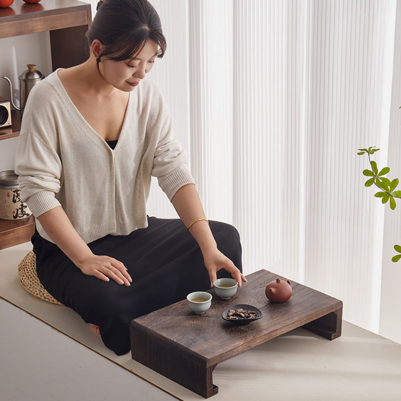 Versatile low wooden tea table with Japanese inspiration for multiple spaces in your home or office.