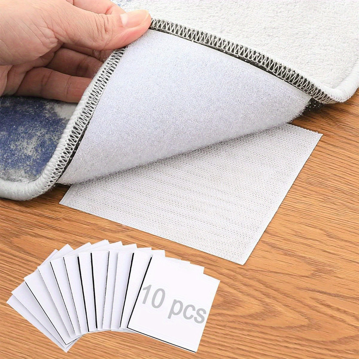 Get yourself a pack of 10 Black Non-Slip Rug Grippers that are both reusable and washable. These dual-sided adhesive stickers are perfect for securing area rugs on hardwood floors and tiles, ensuring that corners stay flat. Say goodbye to slipping rugs