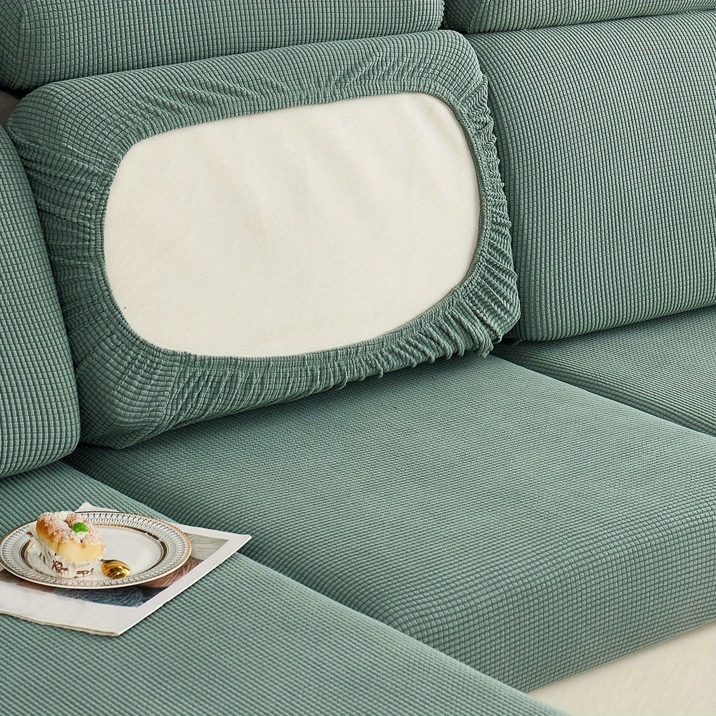 Durable sofa cover protects furniture from spills and stains.