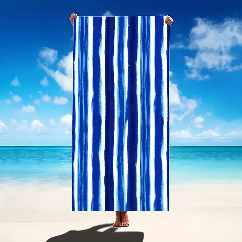 Oversized striped beach towel perfect for adventures. Made of super soft microfiber, quick-dry, sand-free, and ideal for various activities. Available in tropical blue & white. Comes in two sizes and is lightweight and absorbent.