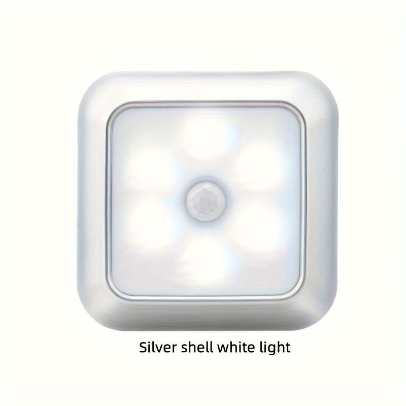 Sleek white night light with motion sensor and adjustable brightness, ideal for cabinets, wardrobes, and bathrooms. Easy installation and cordless design.