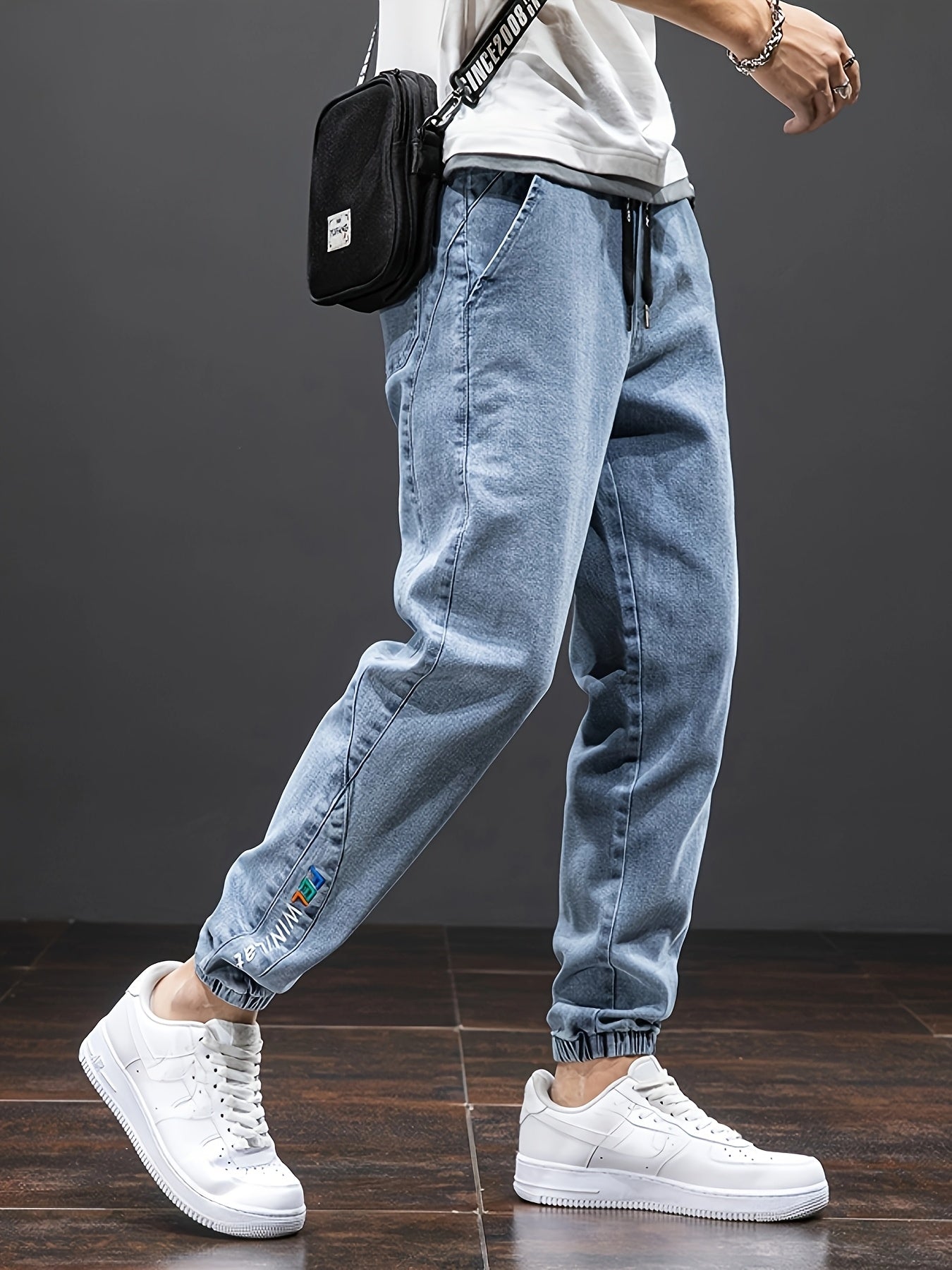 Men's mid-rise cropped jeans with elastic waistband made of 70.7% blend, solid color washed denim, regular fit for all-season wear.