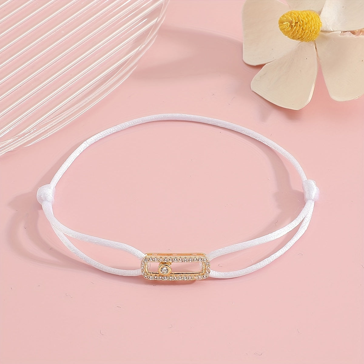 A stylish and timeless charm bracelet designed for women, featuring adjustable sizing and movable zirconia accents. This premium accessory is the perfect gift for any fashionable woman who appreciates high-quality jewelry.