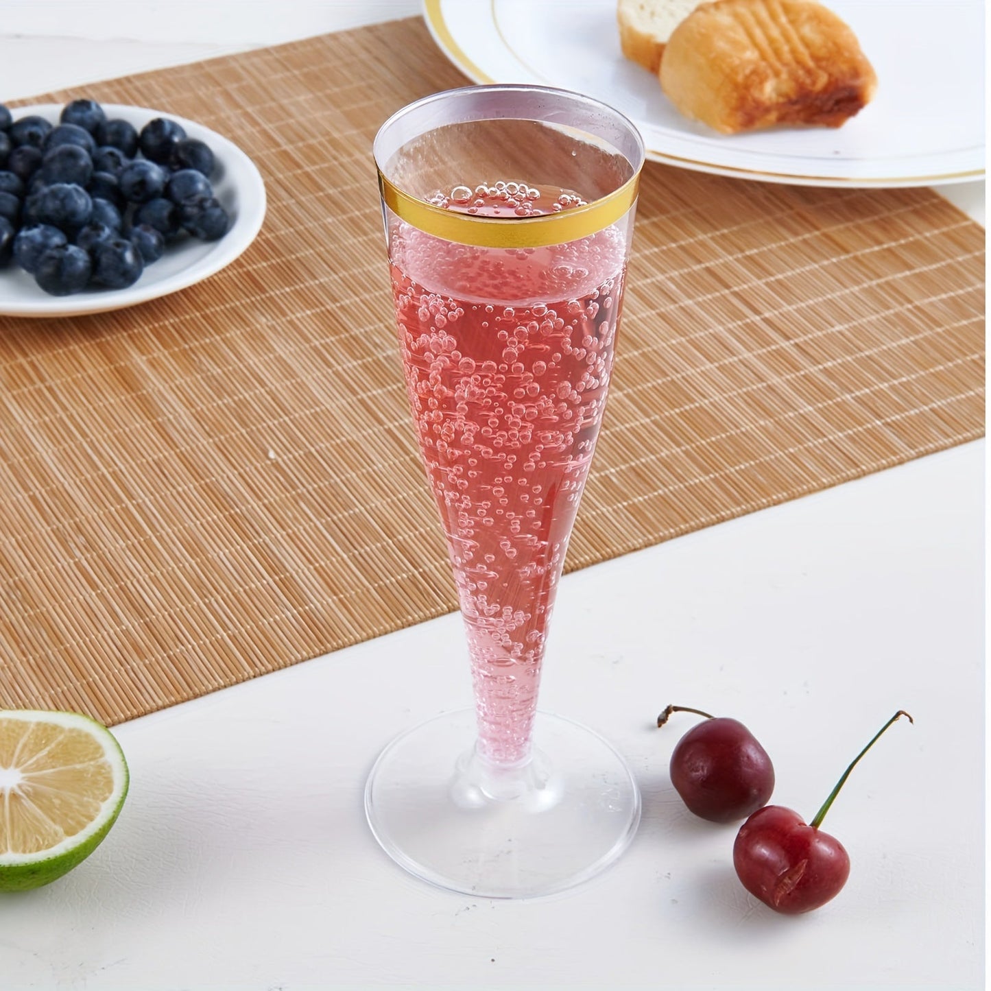 20-Pack of elegant plastic champagne flutes with golden rims, each holding 4.5oz of liquid. These recyclable and reusable toasting glasses are perfect for weddings, birthdays, and bridal showers. Versatile and convenient, these premium disposable