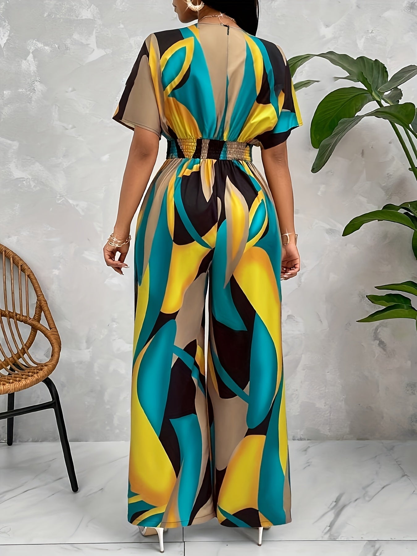 Women's geometric print jumpsuit with batwing sleeves, tie waist, v-neck, machine washable polyester, suitable for all seasons.