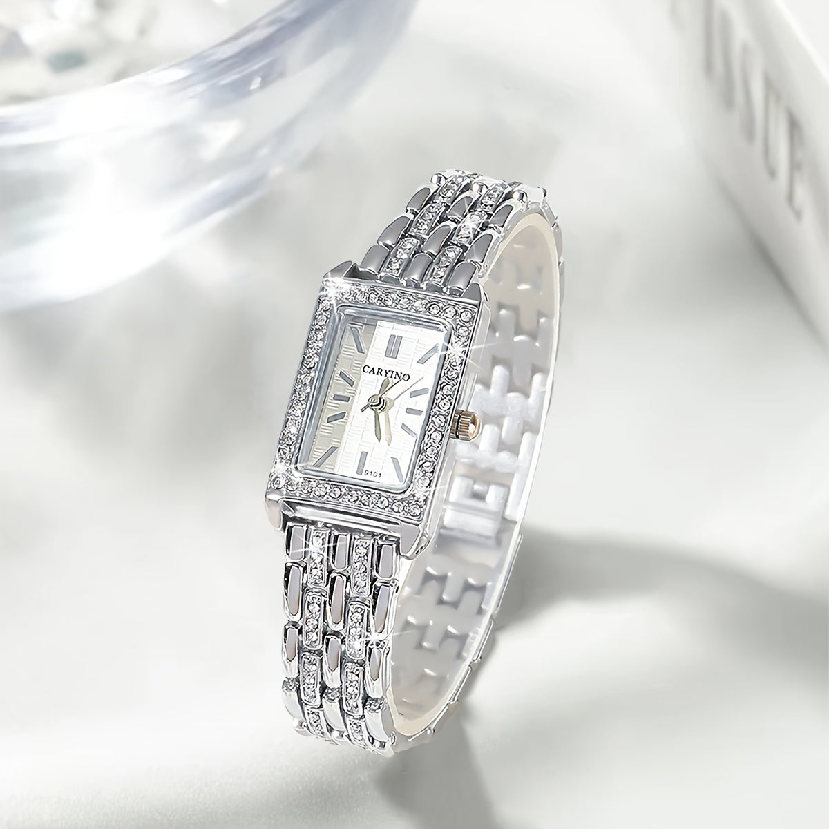 Elegant women's wristwatch with rhinestone jewelry and rectangular zinc alloy case, featuring quartz movement. Ideal gift for birthday or holiday.