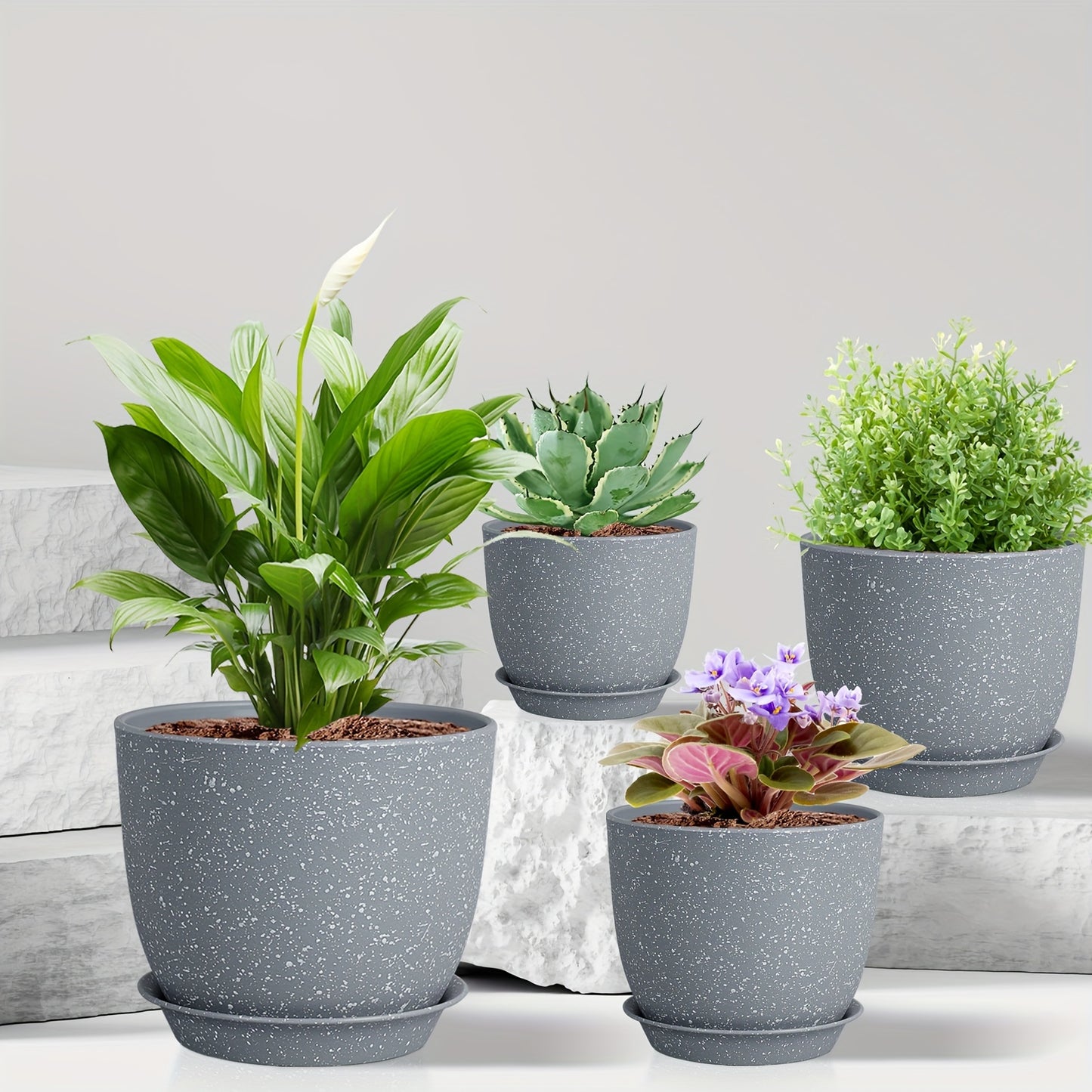 Self-watering planter set includes 5 durable plastic pots with drainage holes, ideal for indoor/outdoor use with succulents, snake plants, and African violets (plants not included).