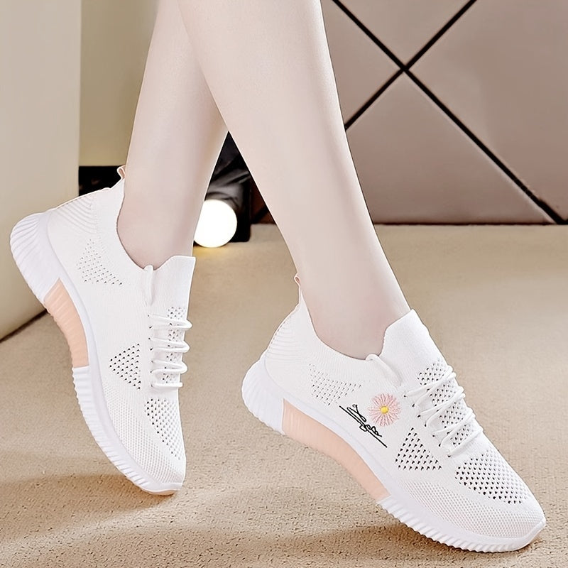 Women's breathable sneakers in chic white and pink with floral embroidery, lightweight and durable for outdoor activities.