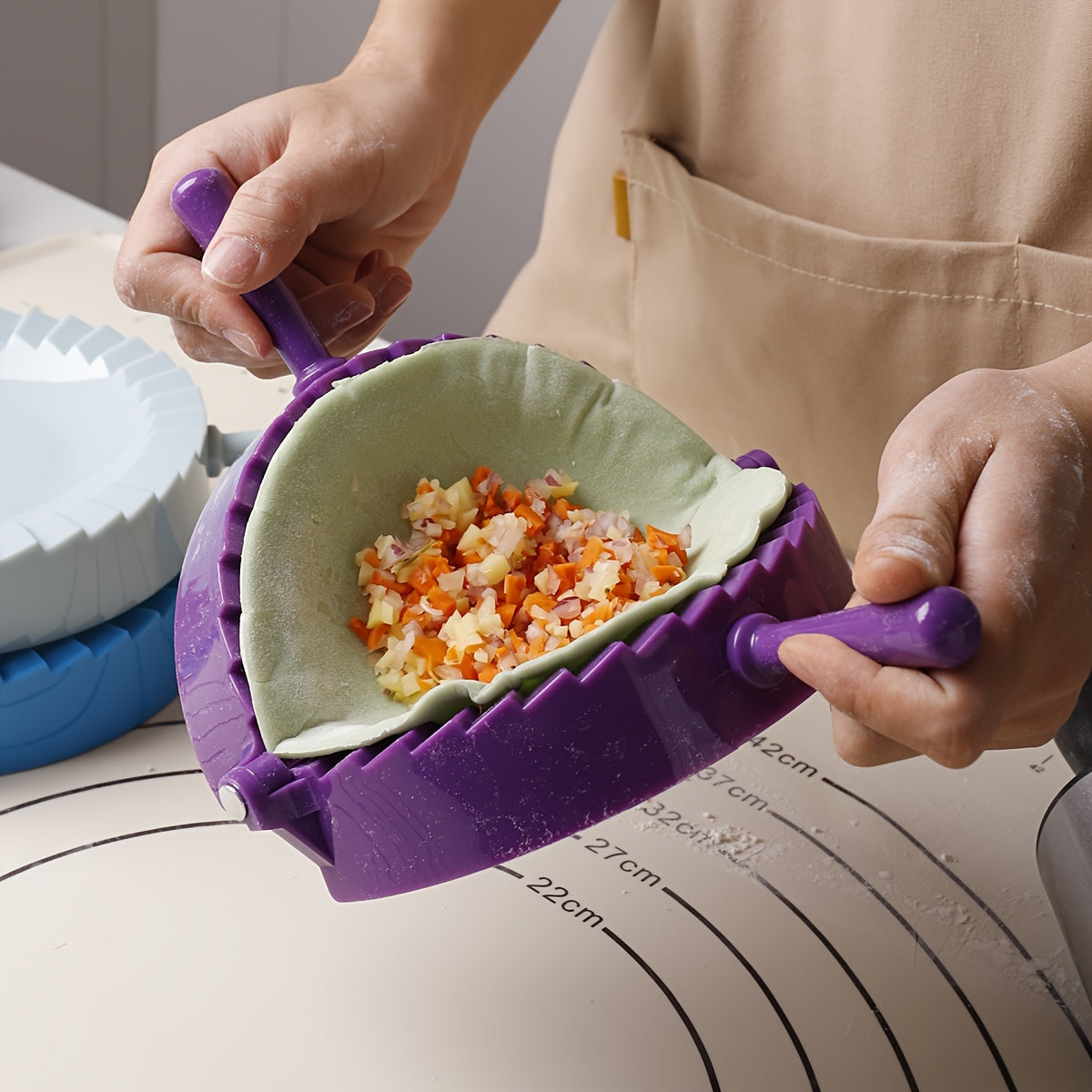 One piece of a plastic dumpling maker, also known as a dumpling mold or manual dumpling wrapper. This versatile kitchen gadget can also be used as an empanada maker and comes with kitchen accessories.