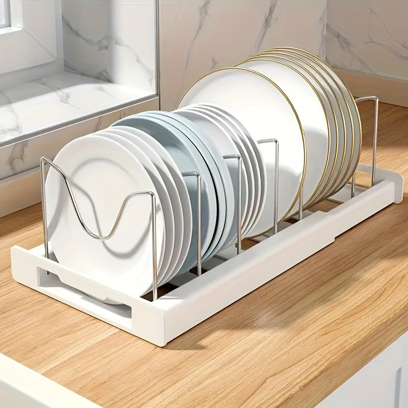 Retractable pot rack for kitchen storage, built into the cabinet under the sink. This adjustable rack is designed to store pots, pans, and lids, making it a convenient kitchen accessory.