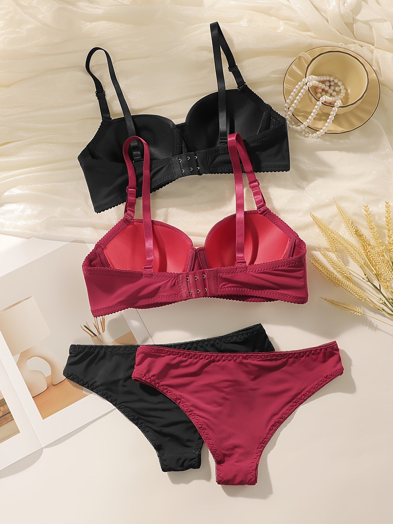 Women's 2-piece Seamless Push-Up Bra & Panty set with underwire support. Made of breathable nylon/elastane blend. Includes black and maroon styles. Hand washable.