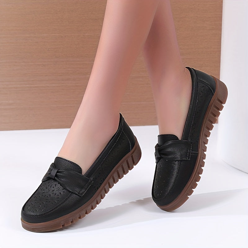 Women's breathable closed toe flat shoes with hollow out design.