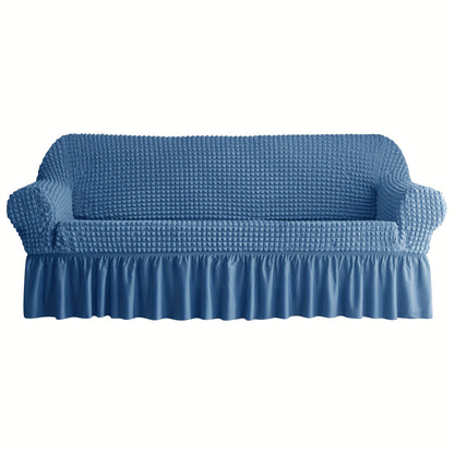 Non-slip elastic sofa cover with skirt for home decor.