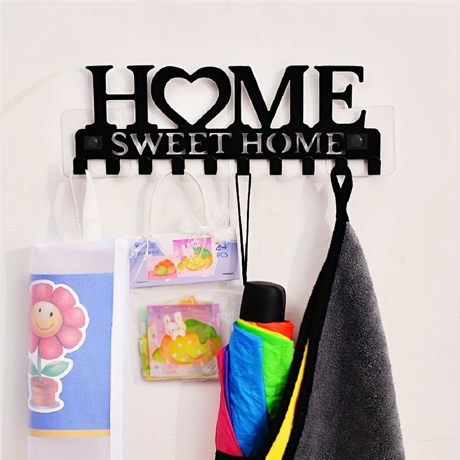 Black metal key holder with decorative hooks for organizing coats, hats, and more. Wall-mounted storage rack for home and hallway. Rust-proof design.