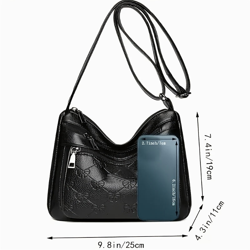 Chic black crossbody bag for women, featuring embossed floral design and bow accent. Ideal for daily use.