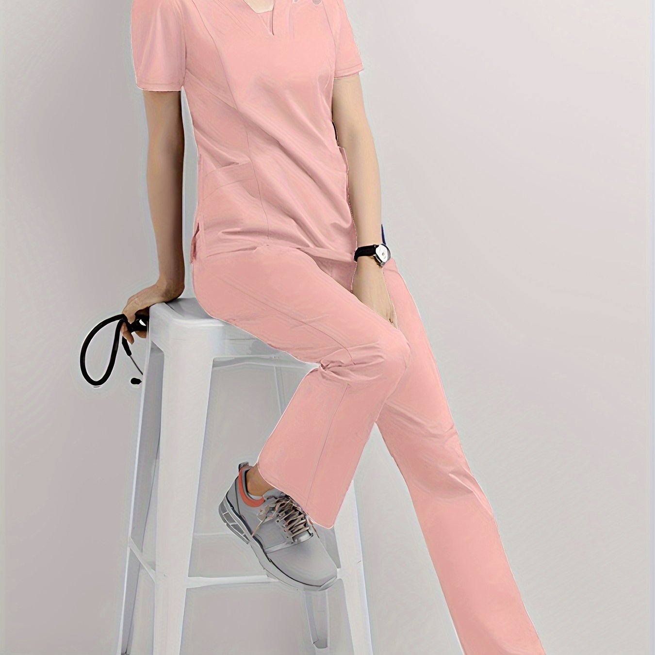 Durable Women's Jogger Scrub Set with V-Neck Top, Drawstring Pants, and Functional Pockets - Ideal for Healthcare Professionals. Made with Stretchy & Breathable Polyester/Spandex, Machine