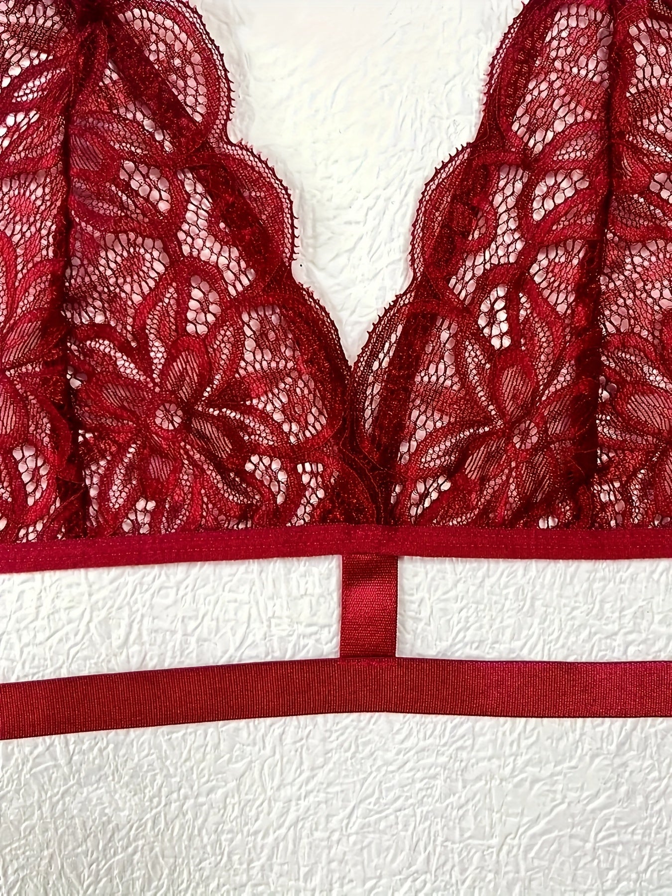 Sexy lace patchwork belt lingerie set includes bra and thong for women.