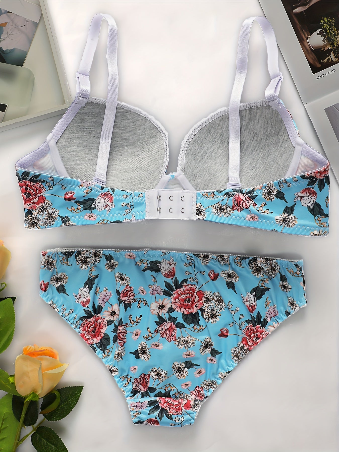 Blue floral lingerie set includes padded underwire bra and panty for a sexy summer look.