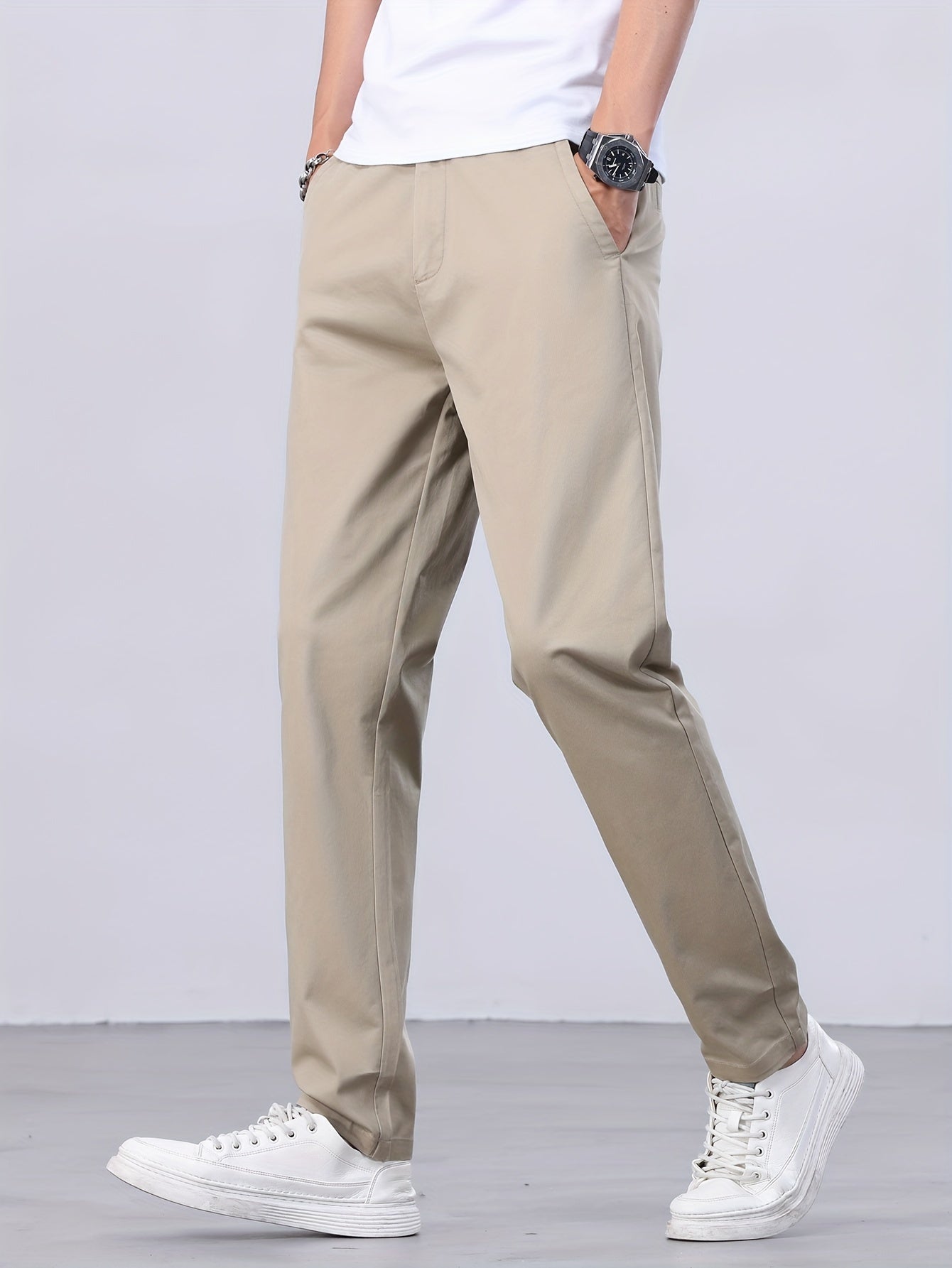 1 Men's all-season casual pants in caramel color, made of cotton blend with slight stretch and regular fit, featuring mid waist, pockets, zipper fly, and woven work style for weekend casual.