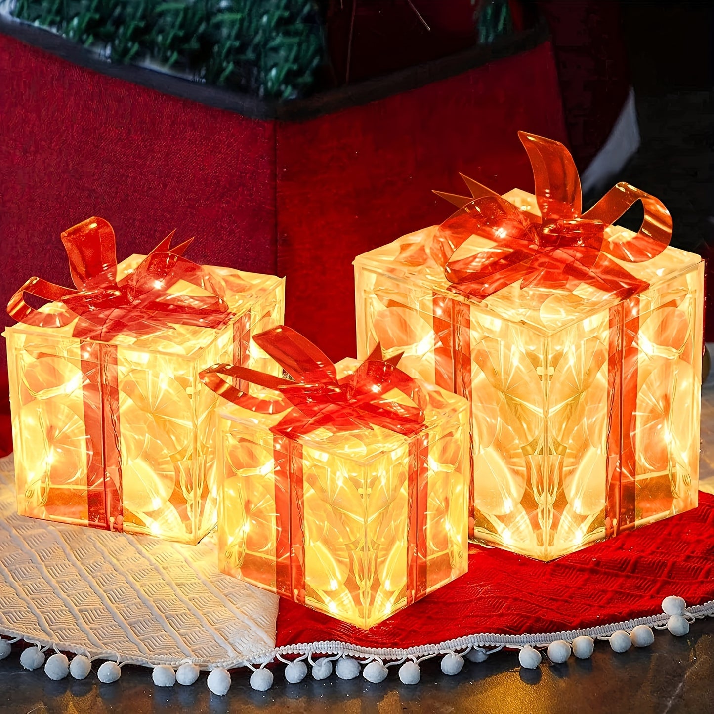 Set of 3 Christmas lighted gift boxes with warm white transparent lights and red bows for outdoor Christmas decorations.