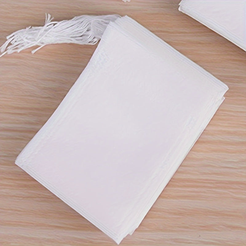 200 pieces of disposable tea bags, made of non-woven fabric and featuring a convenient drawstring closure, perfect for steeping loose leaf tea and spice sachets.