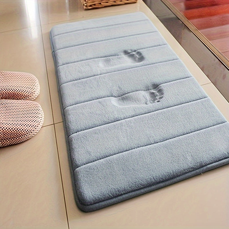 Plush and absorbent coral fleece rug, easy to hand wash, ideal for adding warmth and style to bedrooms, bathrooms, and entryways.