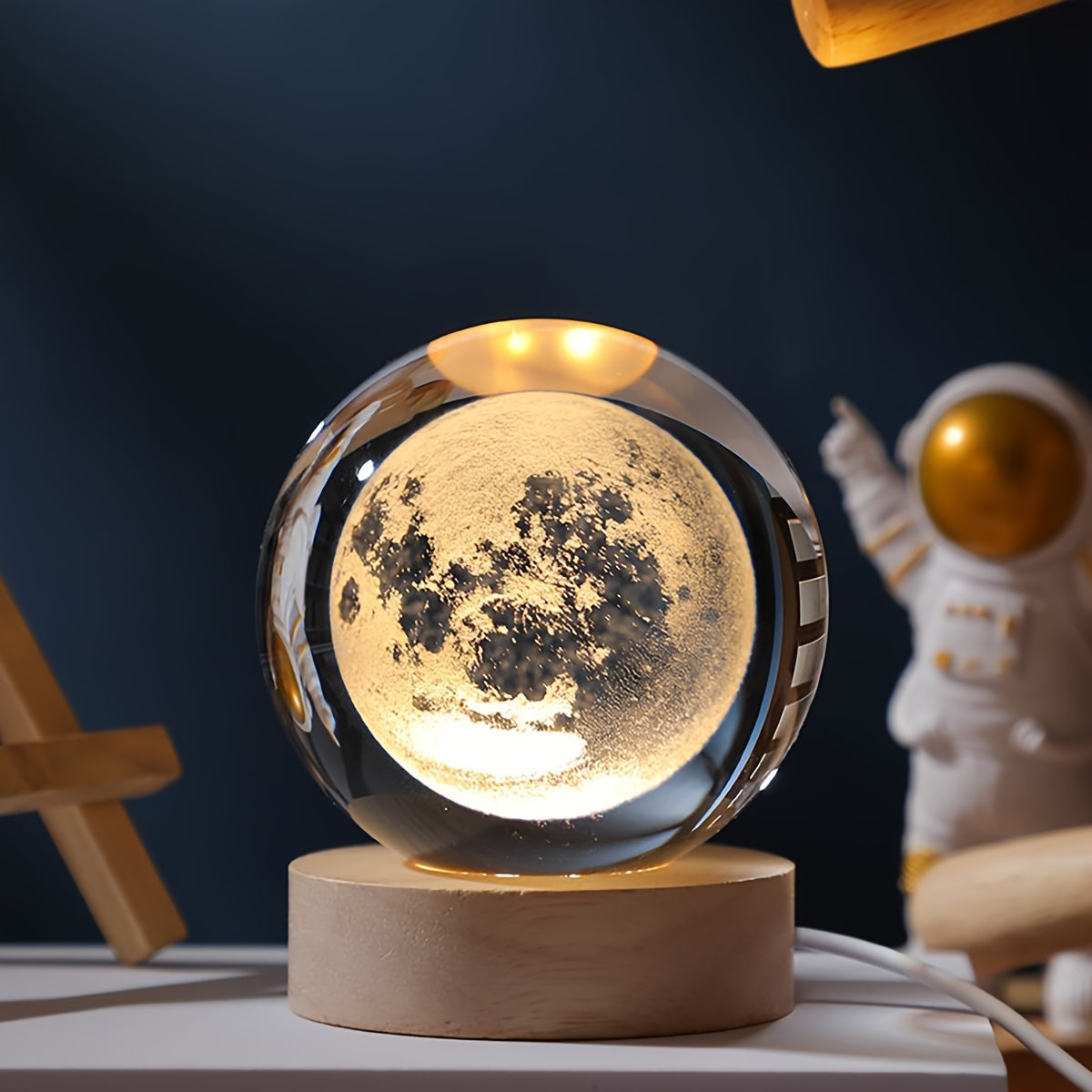 One 3D laser engraved crystal ball night light featuring the solar system and Saturn, powered by USB for home and office decoration, and makes a special gift for Valentine's Day, Christmas, or birthdays.