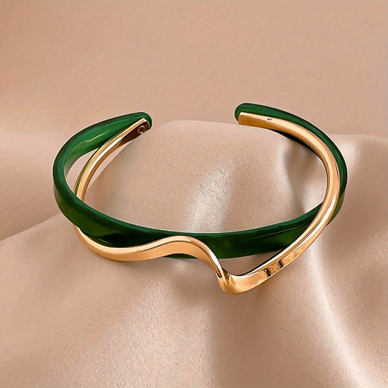 Wave-shaped cuff bangle with faux pearl inlay, featuring a minimalist style in 18K gold plating, ideal for women's jewelry collection