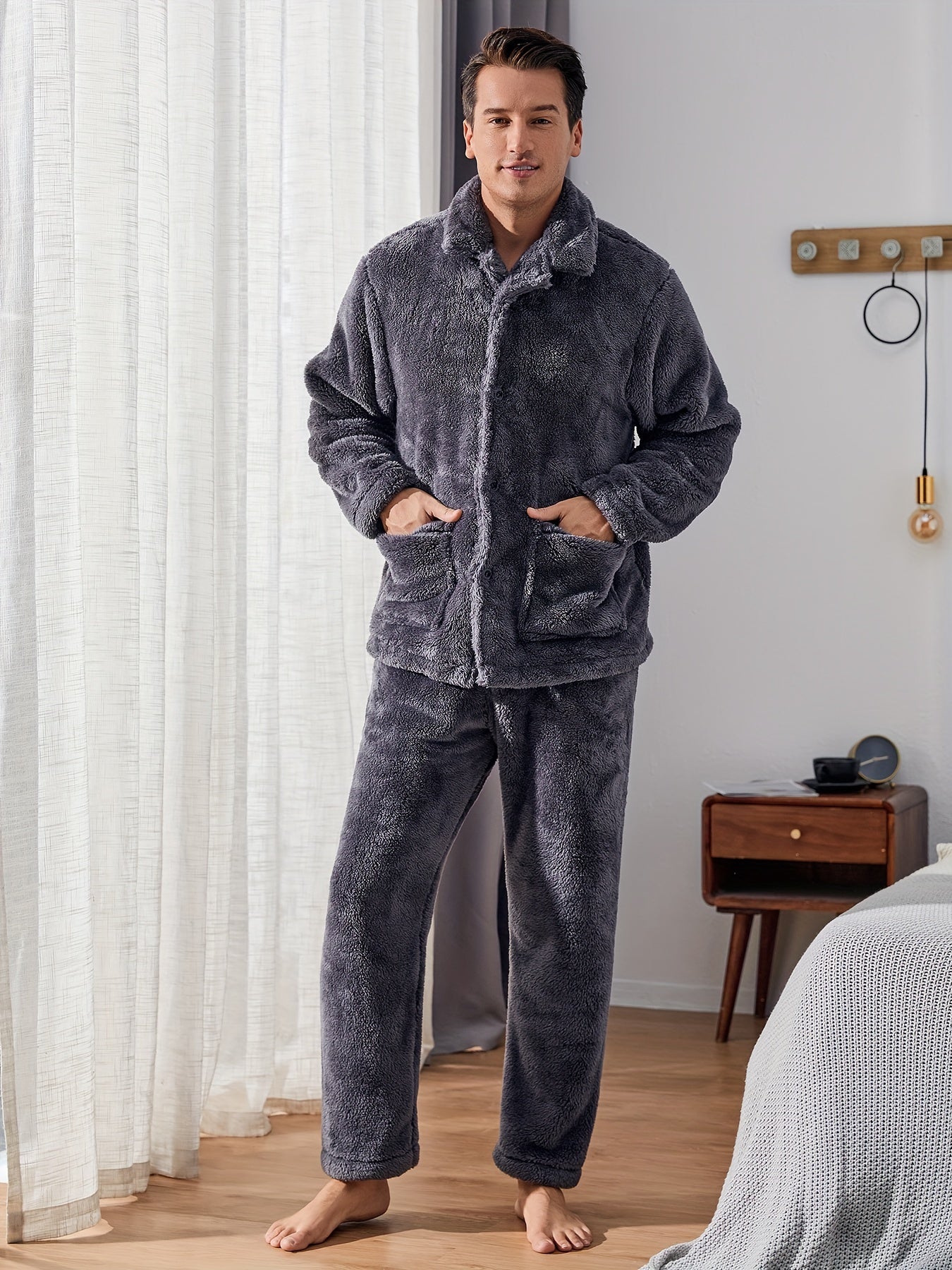 Warm and cozy men's fleece pajama set with pockets, perfect for winter. Features long sleeve top and pants. Machine washable.