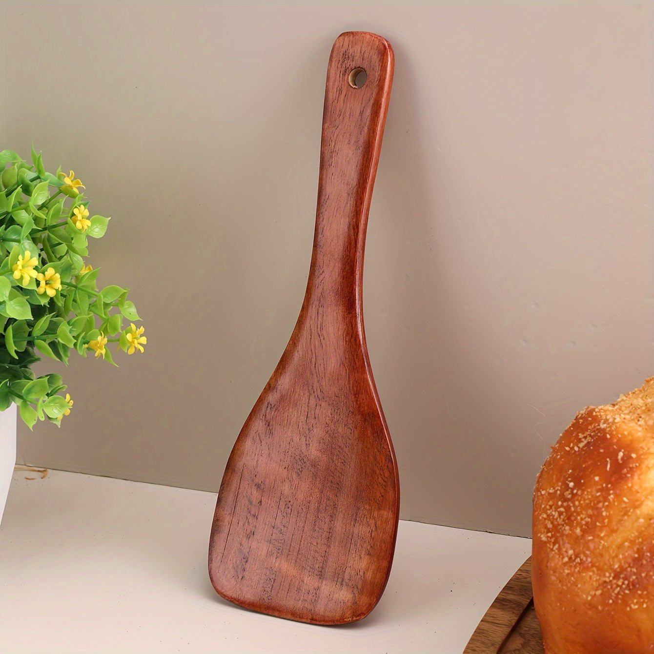 Eco-friendly wooden rice paddle and serving spoon for easy, healthy cooking.