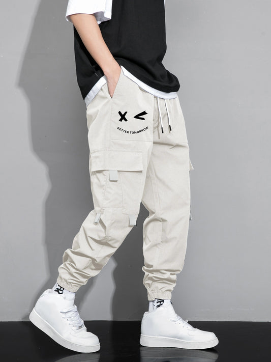 Stylish cargo pants with multiple pockets for men, featuring a loose fit and drawstring waistband for a casual outdoor streetwear look.