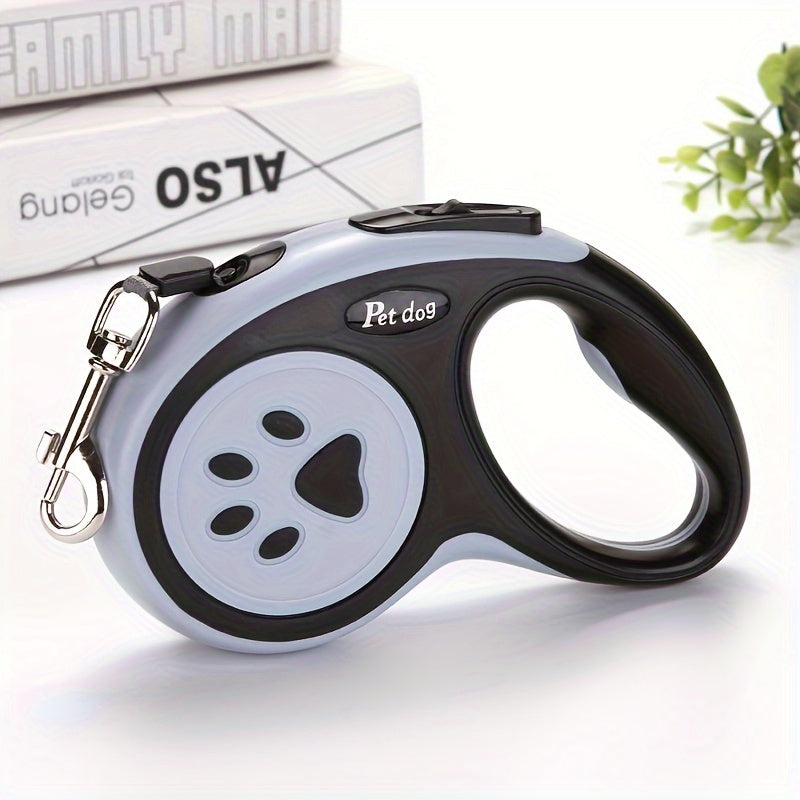 Durable polyester retractable dog leash featuring paw print design, ideal for dogs. Easy to use and store.