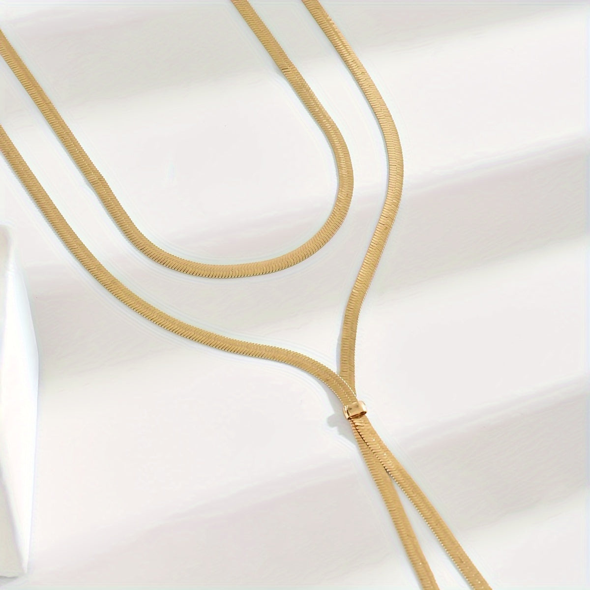 One piece of timeless and alluring Y-shape long snake chain necklace made of iron material, without plating. Versatile for both daily wear and party occasions.