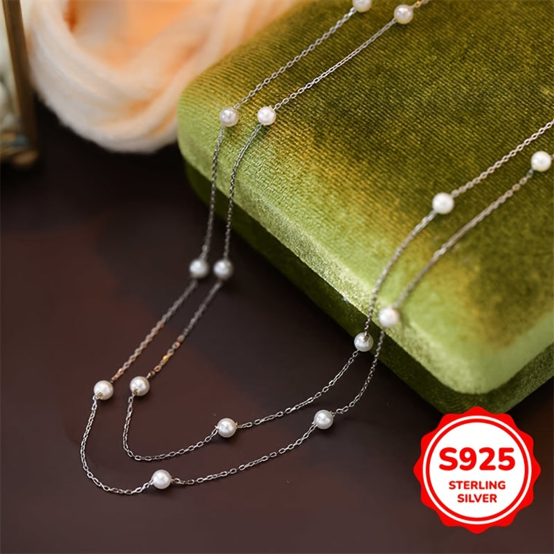 This double-layer pearl necklace is made of 3.02g of S925 sterling silver, giving it a simple and elegant look. The light luxury and high-end design make it perfect for women to wear as a clavicle chain. It is an ideal gift for birthdays, Mother's Day