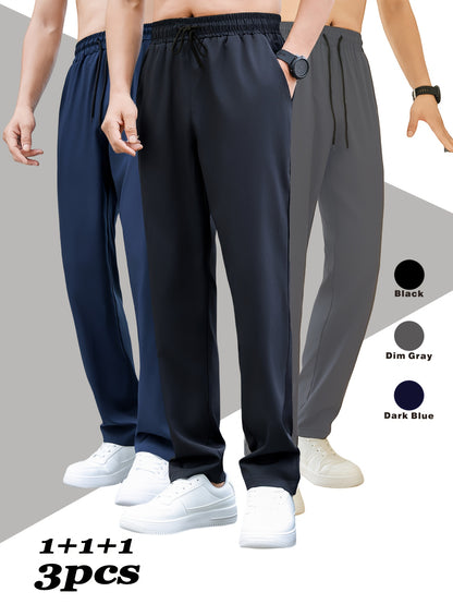 Men's 3-pack athletic and casual pants in durable, stain-resistant polyester blend. Loose fit with straight leg, solid color, drawstring waist, and machine washable.