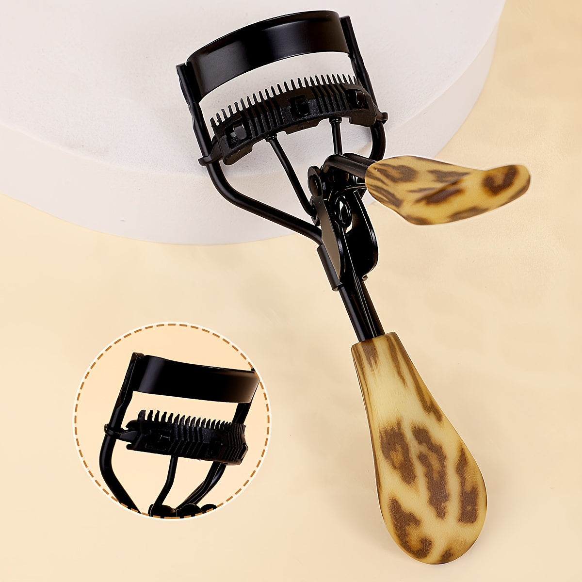 Compact eyelash curler with stainless steel curler and comb for lasting curl, ideal for daily use to enhance lashes.