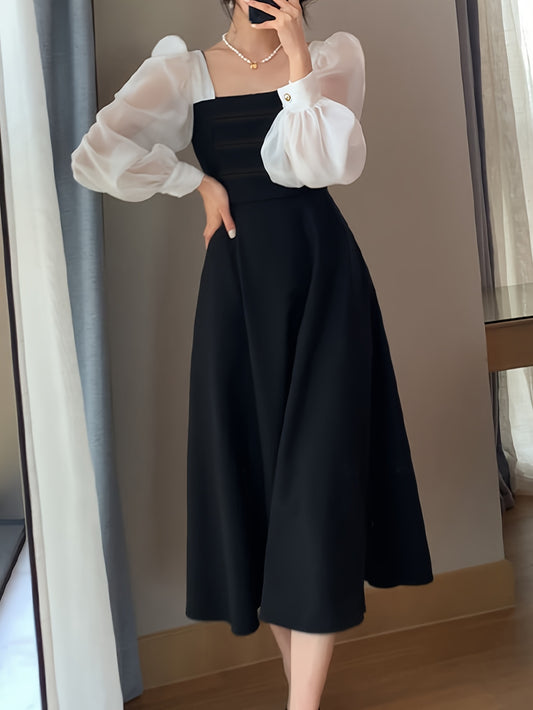 Description: Stylish black organza A-line dress in a chic design featuring long sleeves, a French-inspired square neckline, vintage mesh detail, ideal for spring and autumn events.