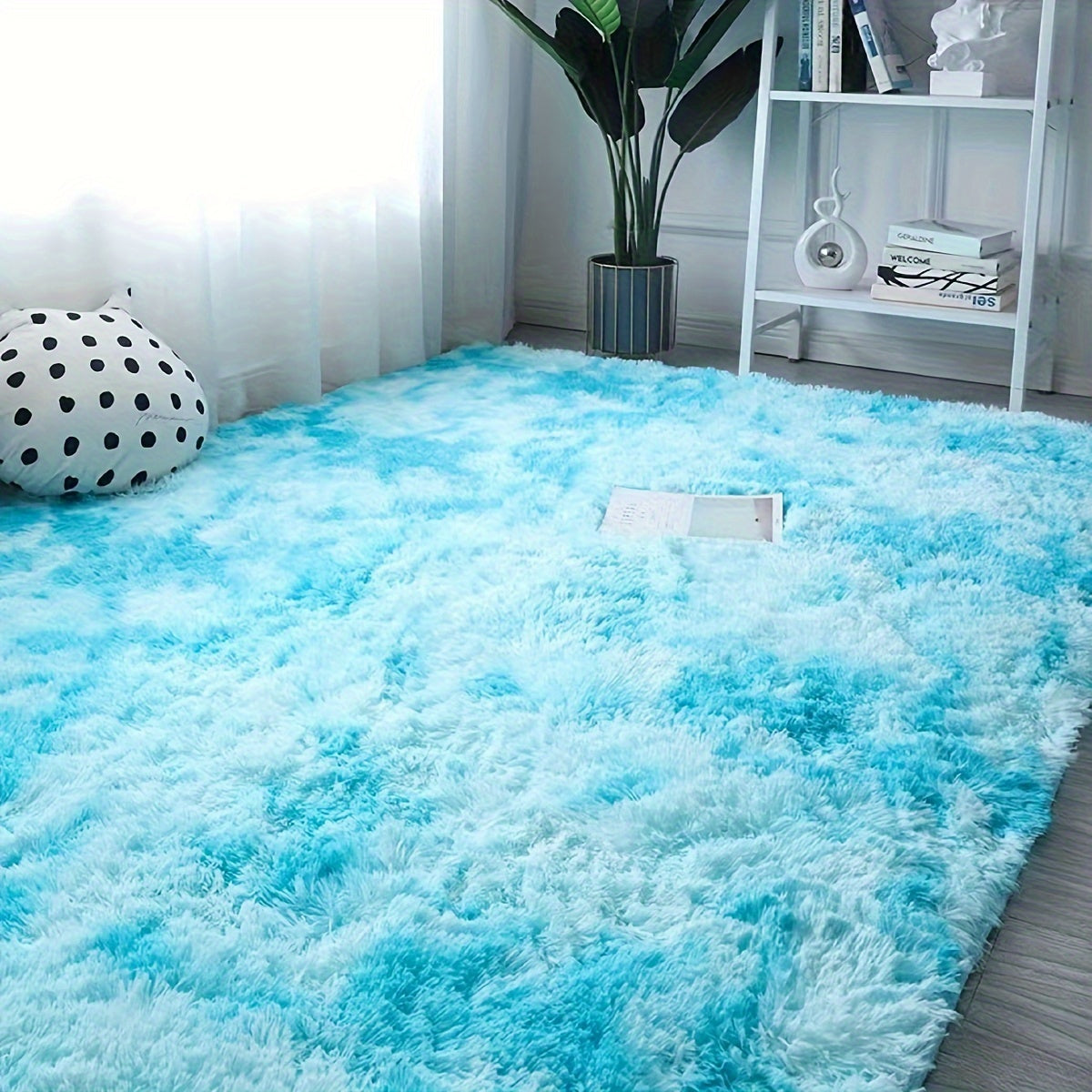 Add some style to your living space with this trendy tie-dye rug. Perfect for lounges, bedrooms, or any other cozy area, this fluffy throw carpet will bring warmth and decoration to your home. Versatile enough to be used in various spaces like living