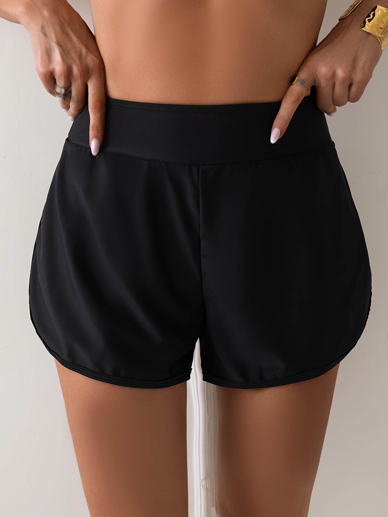 Stylish high-waist swim shorts for women with double layers and side split, ideal for beach or casual wear.