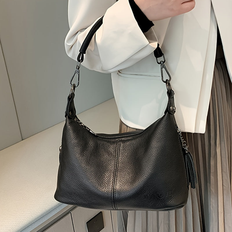 Women's genuine leather shoulder bag with large capacity, adjustable strap, zipper closure, casual style in black or blue. Ideal for daily commute, shopping, and travel gifts.